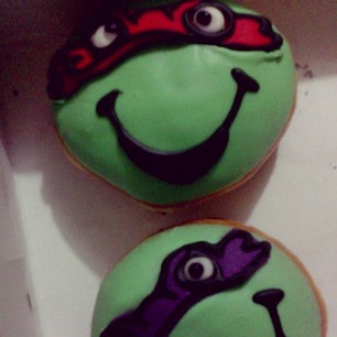 Only 2 more left. Jael sure does like these @krispykremeph Teenage Mutant Ninja Turtle donuts!